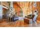 Cozy living room featuring a stone fireplace, wood accents, and comfortable seating arrangement at 49 Holly Springs Ne Rd, White, GA 30184