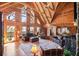 Spacious living room featuring wood walls, hardwood floors, high ceilings, large windows and comfortable seating at 49 Holly Springs Ne Rd, White, GA 30184