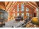 Expansive living room with high ceilings, large windows, and a stone fireplace at 49 Holly Springs Ne Rd, White, GA 30184