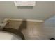 Tiled floor with a partial view of the toilet and the adjacent washlet controls at 504 Overlook Rd, Covington, GA 30052