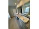 Bathroom with dual vanity featuring granite countertops and vessel sinks at 504 Overlook Rd, Covington, GA 30052