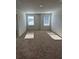 Spacious bedroom with two windows allowing for ample natural light at 504 Overlook Rd, Covington, GA 30052