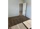 A view of a bedroom with an open white door at 504 Overlook Rd, Covington, GA 30052