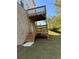 Exterior shot of a wooden deck, stairs, and door at 504 Overlook Rd, Covington, GA 30052