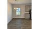 Dining area with natural light, chandelier and gray cabinets at 504 Overlook Rd, Covington, GA 30052