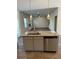 Open kitchen view showcases pendant lighting and stainless steel appliances at 504 Overlook Rd, Covington, GA 30052