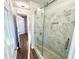 Modern bathroom featuring a glass-enclosed shower with marble tile at 245 Amal Sw Dr # 1008, Atlanta, GA 30315
