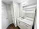 Bathroom features a vanity with a marble countertop and a large mirror at 245 Amal Sw Dr # 1008, Atlanta, GA 30315
