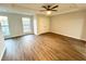 Spacious bedroom with a ceiling fan, hardwood floors, and natural light at 245 Amal Sw Dr # 1008, Atlanta, GA 30315