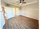 This bedroom features neutral walls, wood-look floors, and a contemporary ceiling fan at 245 Amal Sw Dr # 1008, Atlanta, GA 30315