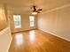 Bright bedroom with hardwood floors, a ceiling fan, and natural light at 245 Amal Sw Dr # 1008, Atlanta, GA 30315