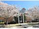 Brick condo building adorned with blossoming trees on a sunny day at 245 Amal Sw Dr # 1008, Atlanta, GA 30315