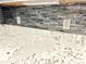 Close up of granite countertops, gray backsplash and outlets at 245 Amal Sw Dr # 1008, Atlanta, GA 30315