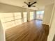 Bright living room with hardwood floors, a ceiling fan, and lots of natural light at 245 Amal Sw Dr # 1008, Atlanta, GA 30315