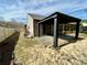 Backyard featuring a covered patio, a fence, and minimal landscaping at 1873 Jameson Cir, Lawrenceville, GA 30043