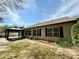 A charming backyard features a covered patio, manicured landscaping, and a privacy fence at 1873 Jameson Cir, Lawrenceville, GA 30043