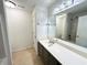 Bright bathroom featuring a large vanity with double sinks, a soaking tub, and a shower at 1873 Jameson Cir, Lawrenceville, GA 30043