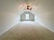 Large bedroom with vaulted ceiling, carpet flooring, a ceiling fan, and natural light at 1873 Jameson Cir, Lawrenceville, GA 30043