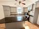 Modern kitchen with gray cabinets, an island, and stainless steel appliances at 1873 Jameson Cir, Lawrenceville, GA 30043