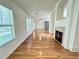 Spacious living room featuring a fireplace and hardwood floors at 1873 Jameson Cir, Lawrenceville, GA 30043