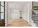 Elegant dining room featuring hardwood floors, wainscoting, a chandelier, and access to storage at 3820 Havenrock Dr, Marietta, GA 30066