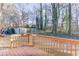 Deck with view of backyard, shed, and wooded area at 448 Strickland Ct, Lawrenceville, GA 30046