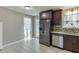 Modern kitchen with dark cabinets and stainless steel appliances at 448 Strickland Ct, Lawrenceville, GA 30046