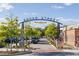 Entrance to Broad Street, featuring a stylish archway and landscaping at 653 Georgetown Ln, Jonesboro, GA 30236