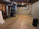 Unfinished basement space with concrete floor and block wall at 229 Smithstone Path, Fayetteville, GA 30214