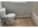 Bathroom featuring a white toilet, a bathtub, and tiled floors at 229 Smithstone Path, Fayetteville, GA 30214