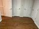 This room shows multiple white doors and wood-look flooring at 229 Smithstone Path, Fayetteville, GA 30214