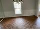 Formal dining room with parquet floors, classic chandelier, and ample natural light at 229 Smithstone Path, Fayetteville, GA 30214