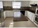 Spacious kitchen with white cabinets, stainless steel appliances, and a central island at 229 Smithstone Path, Fayetteville, GA 30214