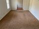 Bright and airy living room with neutral carpet and trim detail at 229 Smithstone Path, Fayetteville, GA 30214