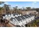 Aerial view of townhouses showcasing architectural details and community setting at 308 Chardonnay Way, Woodstock, GA 30188