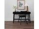 Stylish home office with dark wood desk and chair, on dark hardwood floor at 308 Chardonnay Way, Woodstock, GA 30188