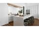 Modern kitchen with white cabinetry, large island, and stainless steel appliances at 308 Chardonnay Way, Woodstock, GA 30188