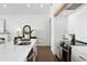 Modern kitchen with white cabinets, quartz countertops and stainless steel appliances at 308 Chardonnay Way, Woodstock, GA 30188