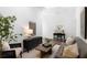 Cozy living room featuring a gray sofa and wood flooring at 308 Chardonnay Way, Woodstock, GA 30188