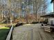 Expansive wooden deck perfect for outdoor dining and entertaining with wooded views at 1025 Charleston Trce, Roswell, GA 30075