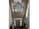 Two-story foyer with chandelier and large windows at 1025 Charleston Trce, Roswell, GA 30075