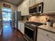 Modern kitchen with stainless steel appliances, granite countertops, and ample cabinet space for cooking and storage at 1025 Charleston Trce, Roswell, GA 30075