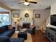 Inviting living room with a fireplace, plush seating, and a neutral color scheme for a comfortable atmosphere at 1025 Charleston Trce, Roswell, GA 30075