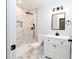 Bathroom featuring a shower stall, vanity with white marble style tile at 413 Cranfill Se Rd, Marietta, GA 30060