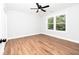 Bedroom features luxury vinyl plank flooring, a large window, and neutral paint at 413 Cranfill Se Rd, Marietta, GA 30060