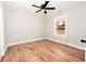 This bedroom has hardwood floors, a ceiling fan, new windows and neutral walls at 413 Cranfill Se Rd, Marietta, GA 30060