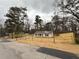 Charming newly renovated home with a light grey roof, light siding, and a new fence bordering the property at 413 Cranfill Se Rd, Marietta, GA 30060