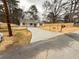 A view of the newly renovated house with wood accents on the windows and the new fence surrounding the property at 413 Cranfill Se Rd, Marietta, GA 30060