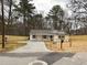 A view of the newly renovated house with wood accents on the windows and the new fence surrounding the property at 413 Cranfill Se Rd, Marietta, GA 30060