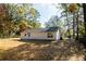 View of the exterior showing the freshly painted siding and spacious backyard at 413 Cranfill Se Rd, Marietta, GA 30060